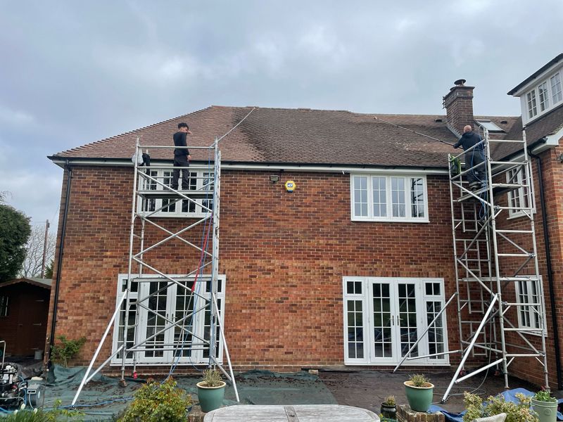Roof cleaning carried out safely from scaffold towers by The Roof Moss Cleaners in Bursledon